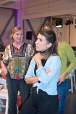 Volunteers Susan Manchak and Marie Pochitaloff (with Jaime Pierce in the background)